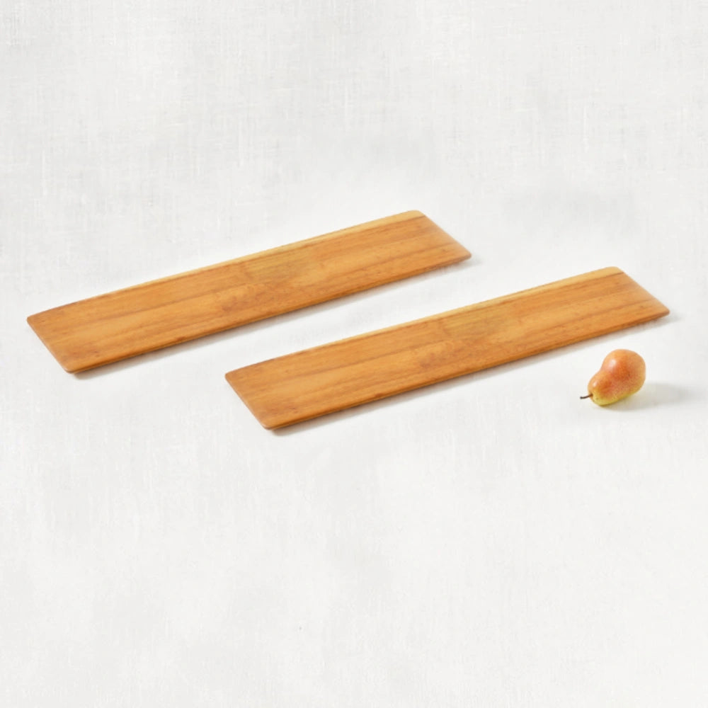 Two long, super lightweight cheeseboard trays made from 100% certified teak wood, featuring beveled edges, shown from a diagonal perspective on a white background.