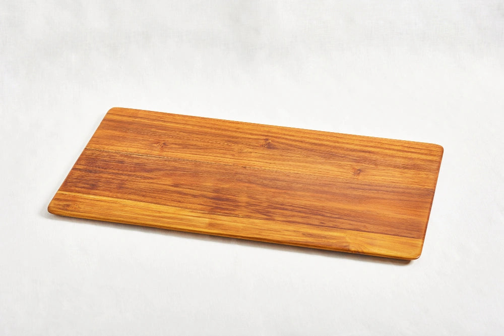 One large super lightweight cutting board made from 100% certified teak wood, featuring a beveled edge, displayed on a white background.