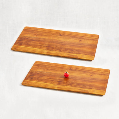 Two large super lightweight cutting boards made from 100% certified teak wood, featuring beveled edges, displayed side by side on a white background.